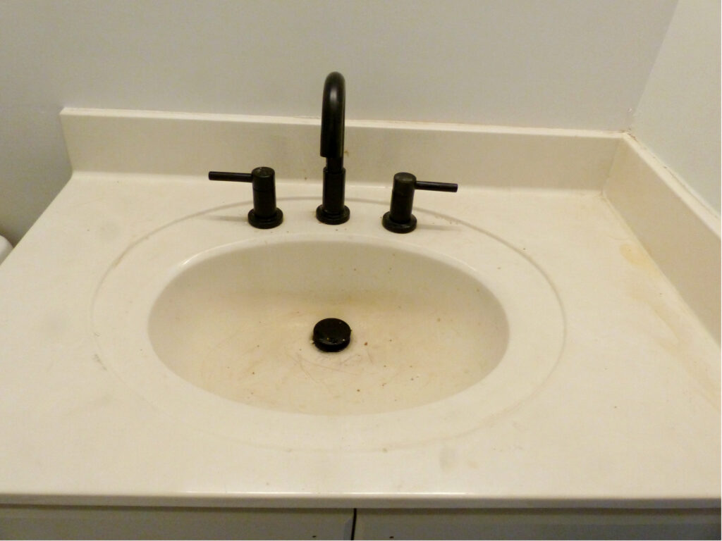 Old Bathroom sink discolored by makeup over time (BEFORE)