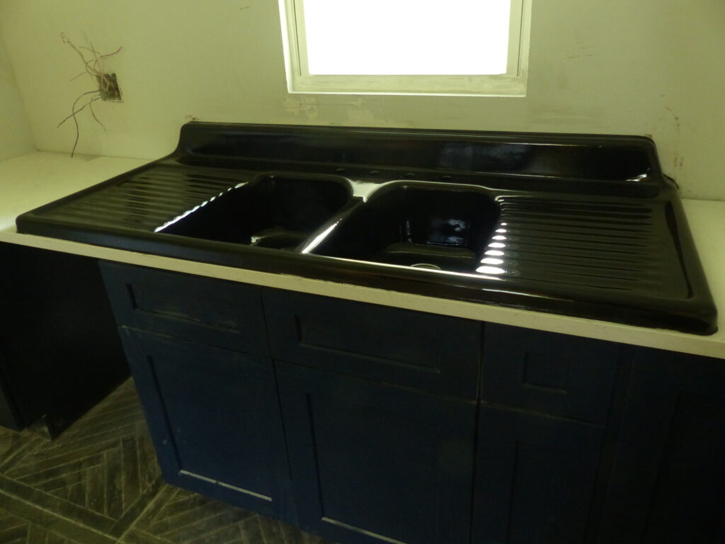 Beautiful new-look cast-iron kitchen sink after a black gloss urethane resurface (AFTER)