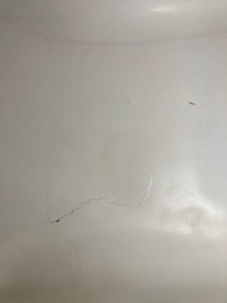 Crack at bottom of tub - repair, then re-glaze