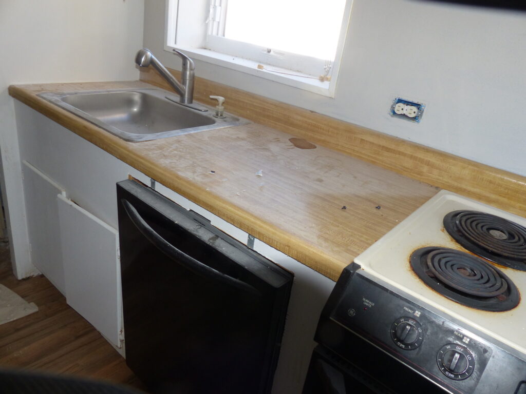 Old traditional oak laminate countertop in need of a fresh touch (BEFORE)
