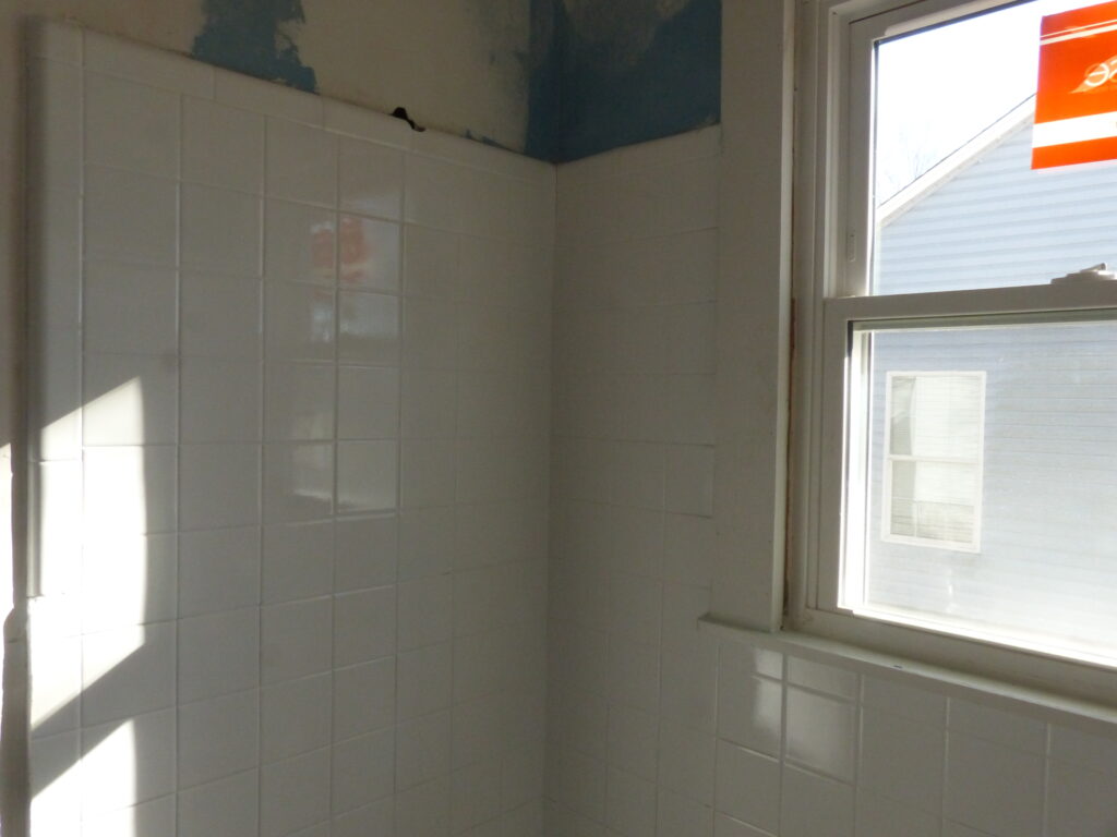 Tiled Surround after repairs to cracked Tiles, and full resurface