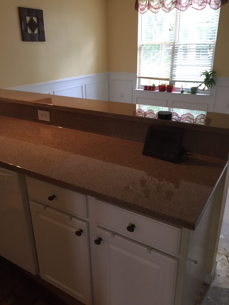 Edging repaired, countertop resurfaced in "Late" Multifleck, followed by clear high-gloss pour-on epoxy topcoat (AFTER)