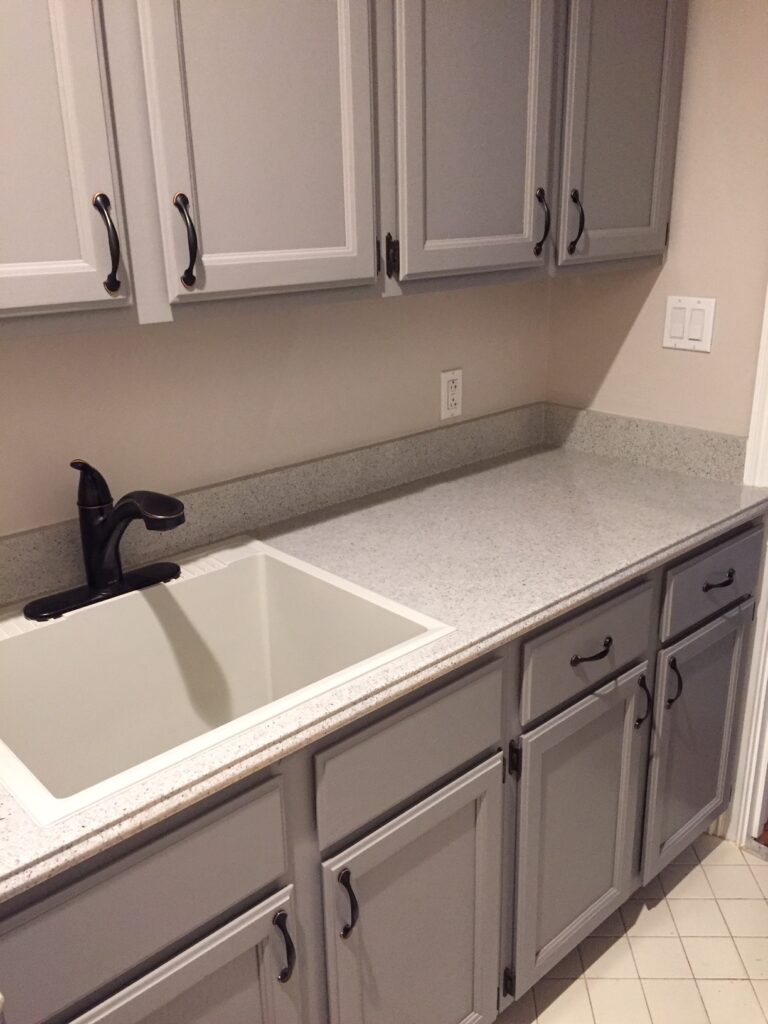 New edging applied to countertop, "Desert stone" multifleck was chosen, which was completed with a high-gloss pour-on epoxy topcoat (sink was also resurfaced in a light grey, with a satin topcoat (AFTER)