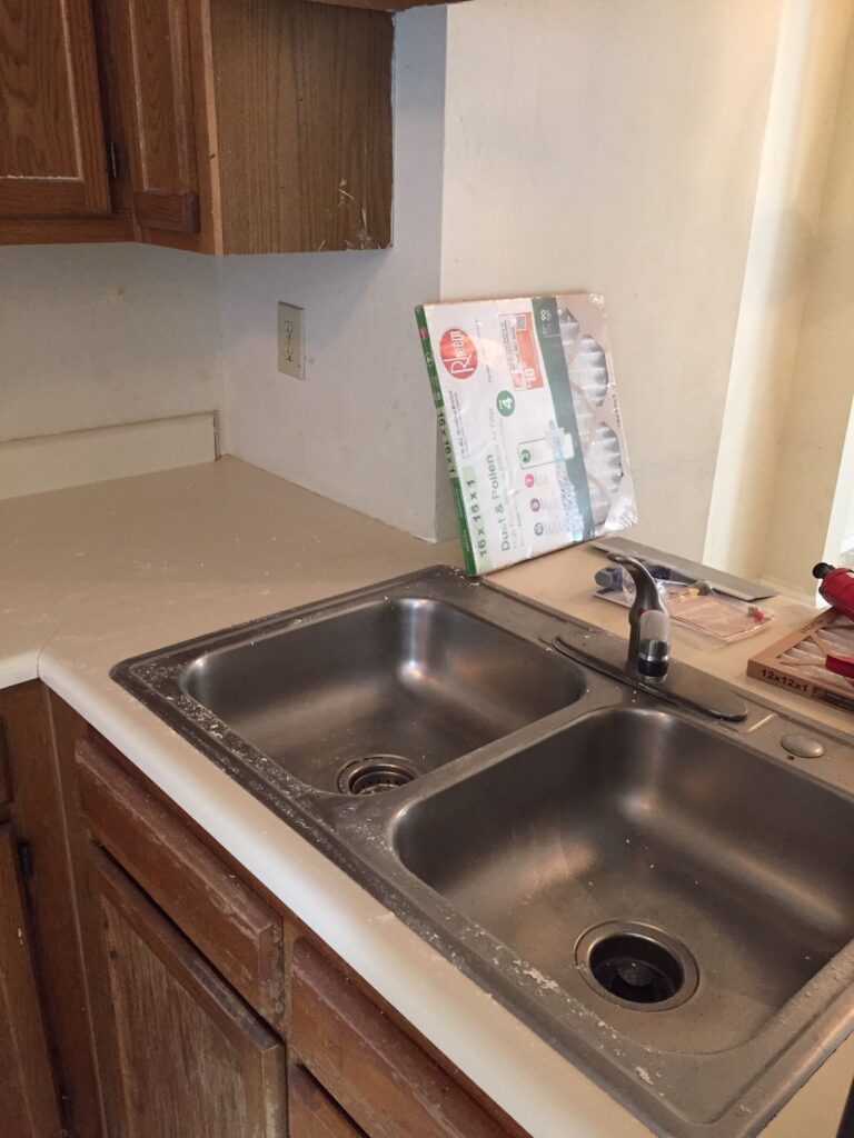 This old drab laminate countertop in the University District was in need of repair and a fresh touch (BEFORE)